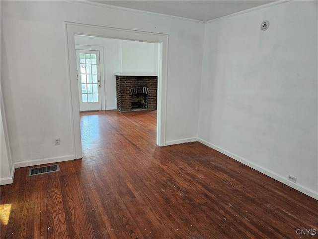 unfurnished living room featuring a fireplace, hardwood / wood-style flooring, and ornamental molding