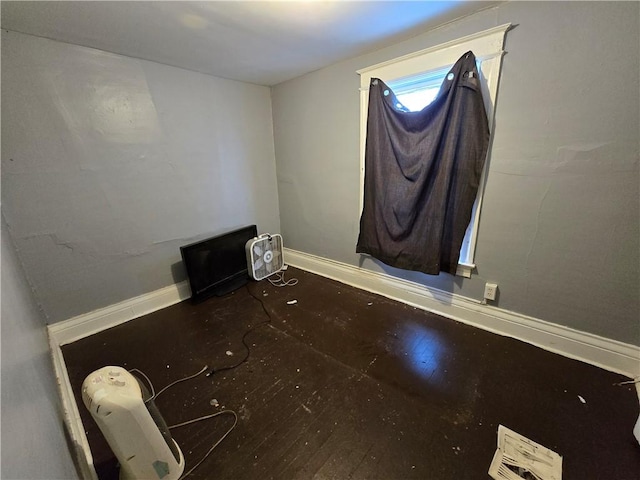 empty room featuring wood-type flooring