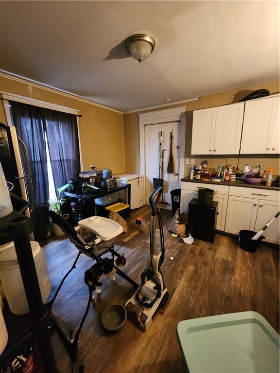 dining area featuring dark wood-type flooring