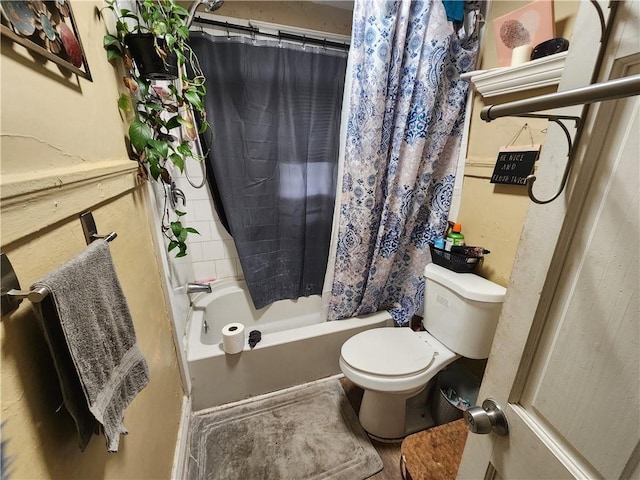 bathroom with shower / bathtub combination with curtain and toilet