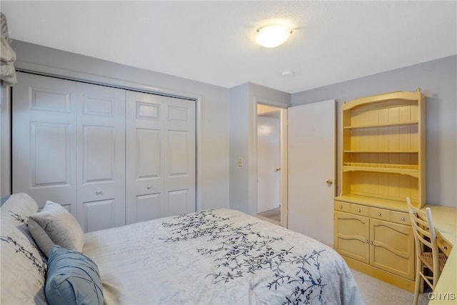 carpeted bedroom with a closet