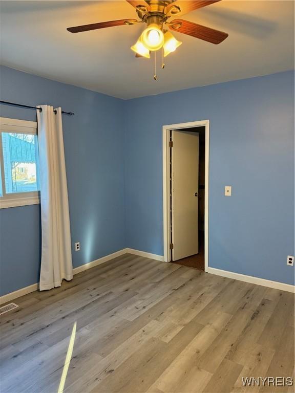 spare room with light hardwood / wood-style floors