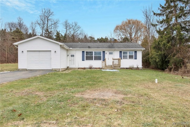 ranch-style home with a front yard and a garage