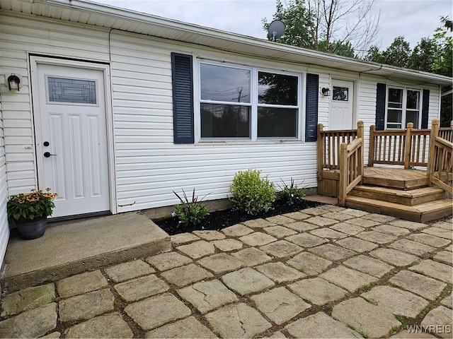 property entrance with a patio area