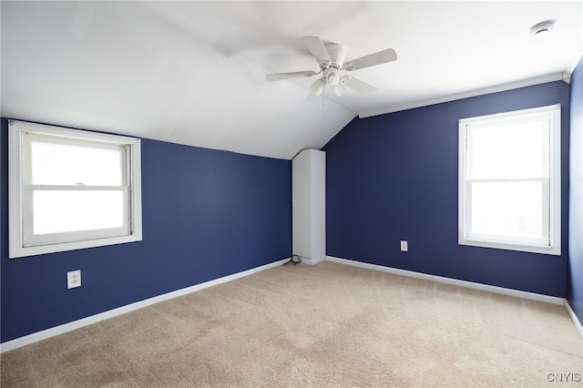 additional living space featuring carpet, ceiling fan, and lofted ceiling