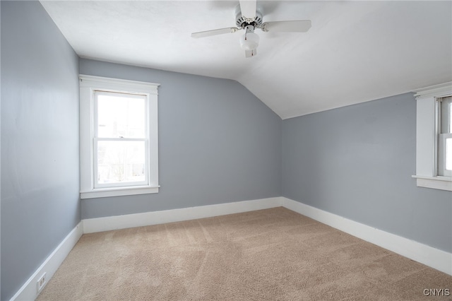 bonus room with carpet flooring, ceiling fan, and vaulted ceiling