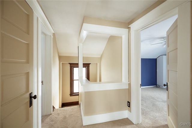 corridor with light colored carpet