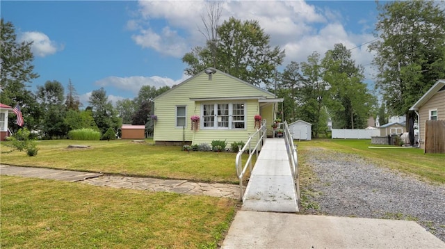 bungalow-style house featuring a front lawn