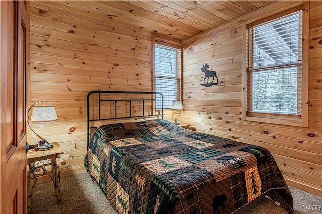 156 S Shore Rd, Webb, NY 13420 - carpeted bedroom with wooden walls and wooden ceiling
