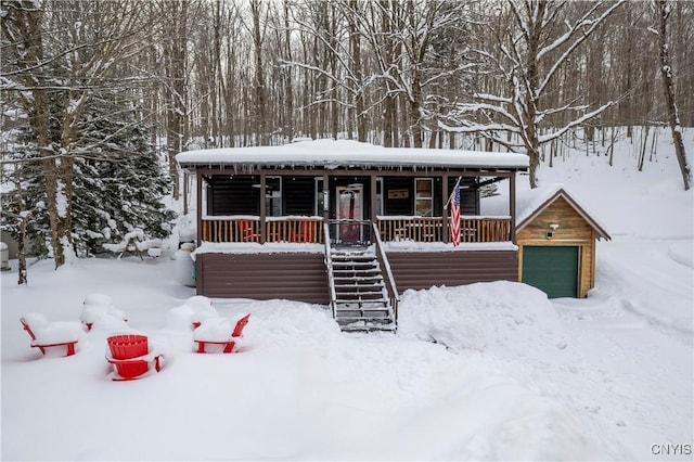 156 S Shore Rd, Webb, NY 13420 - chalet / cabin featuring covered porch and stairs
