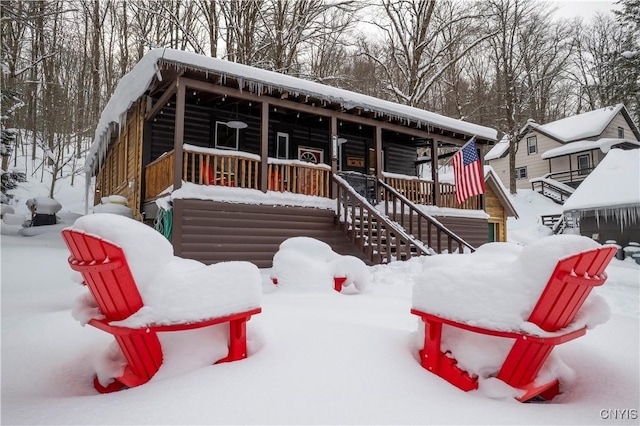 156 S Shore Rd, Webb, NY 13420 - exterior space featuring a porch, log veneer siding, and stairway