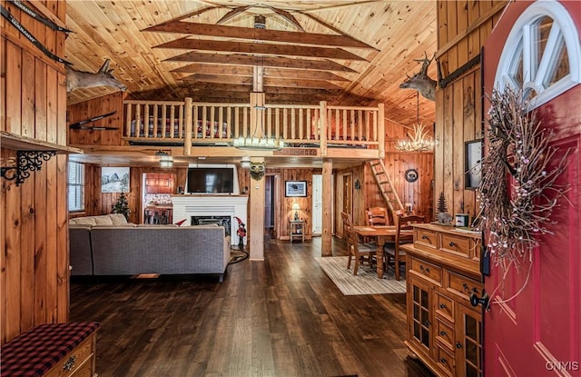 living room featuring wood ceiling, wooden walls, and high vaulted ceiling