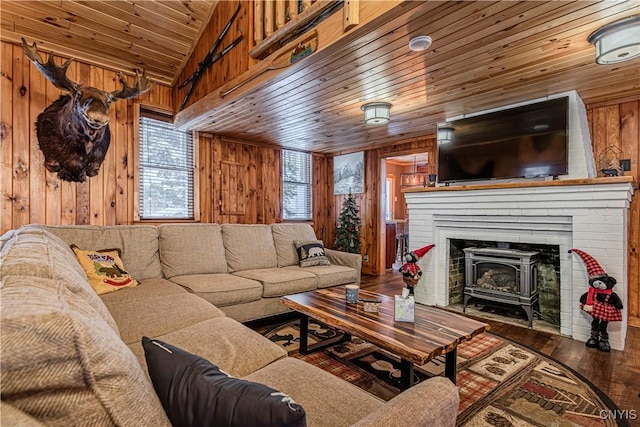 living room with hardwood / wood-style floors, vaulted ceiling, wooden ceiling, and wood walls