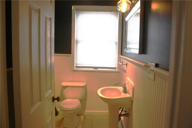 bathroom with tile patterned floors, sink, and toilet