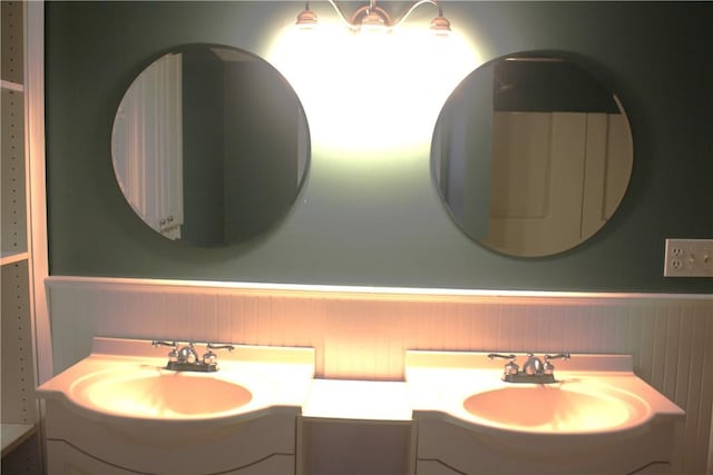 bathroom with wood walls and vanity