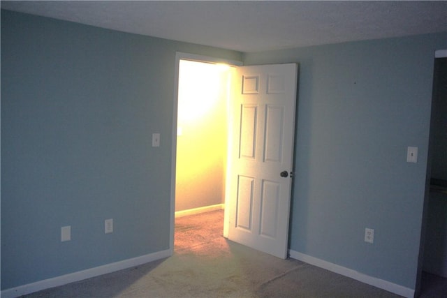 empty room featuring carpet floors