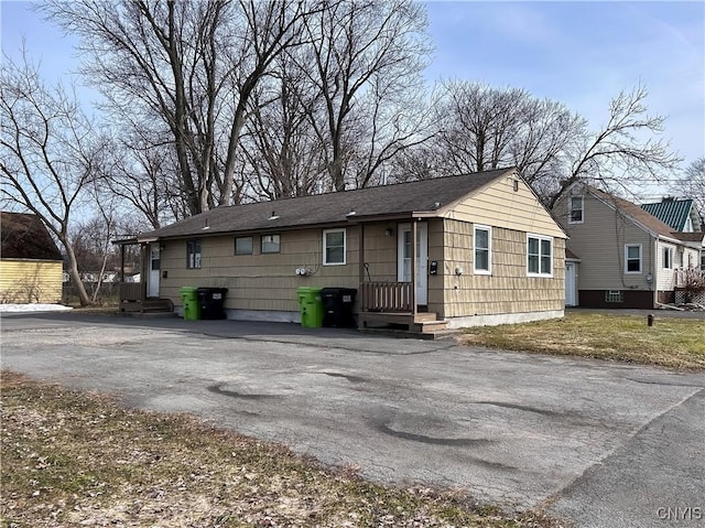 rear view of house with driveway