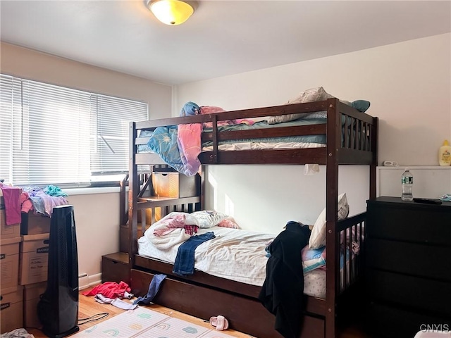 bedroom featuring wood finished floors