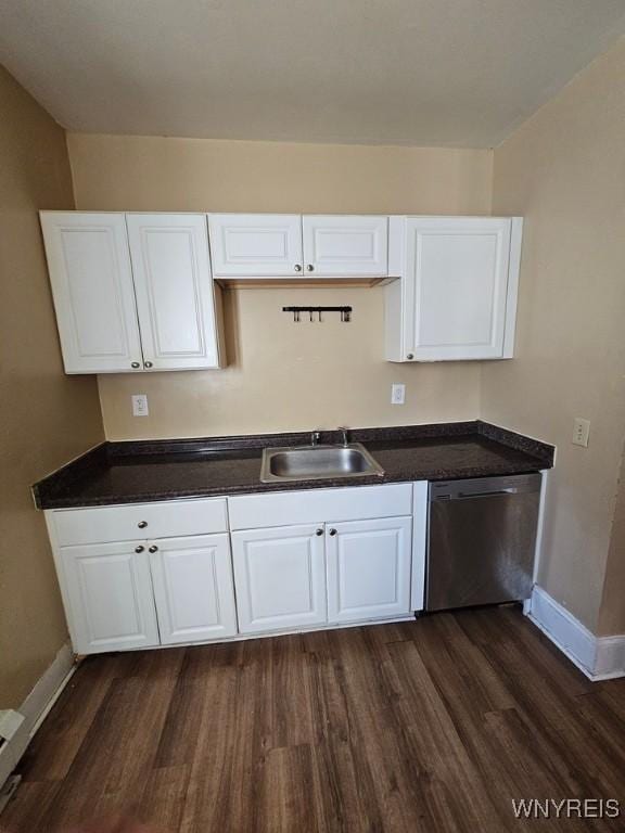 kitchen featuring dishwasher, dark hardwood / wood-style floors, white cabinetry, and sink