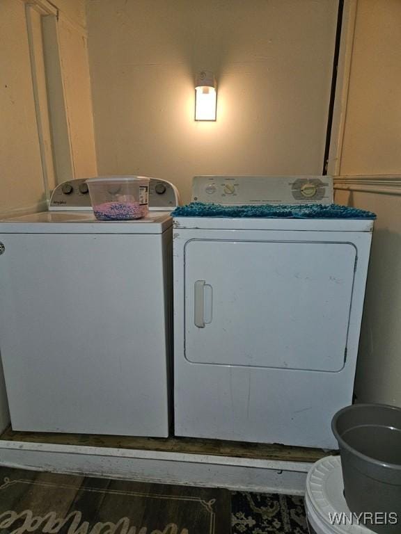 clothes washing area featuring washer and clothes dryer