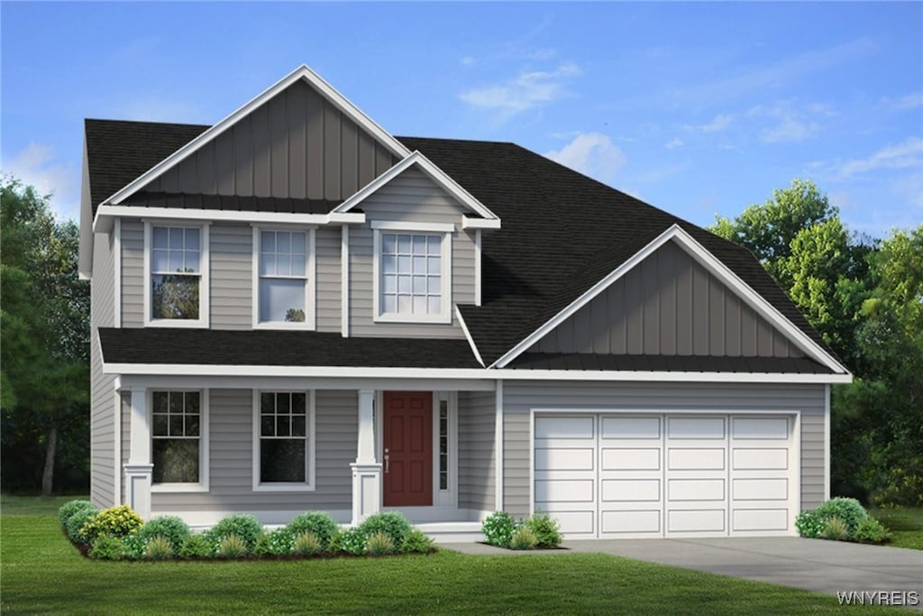 view of front facade featuring a front lawn and a garage