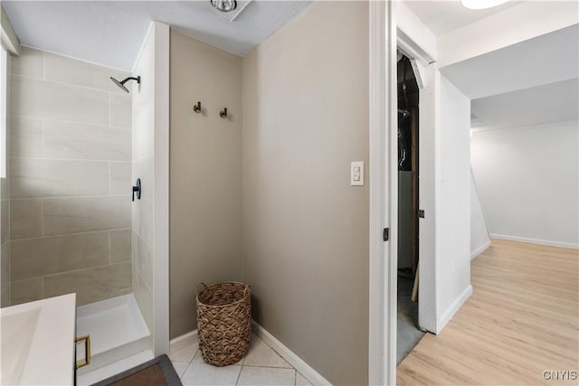 bathroom featuring tiled shower