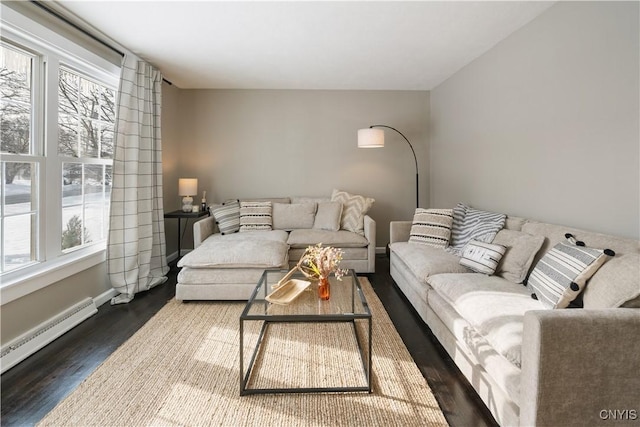 living room with a baseboard radiator, plenty of natural light, and dark hardwood / wood-style floors