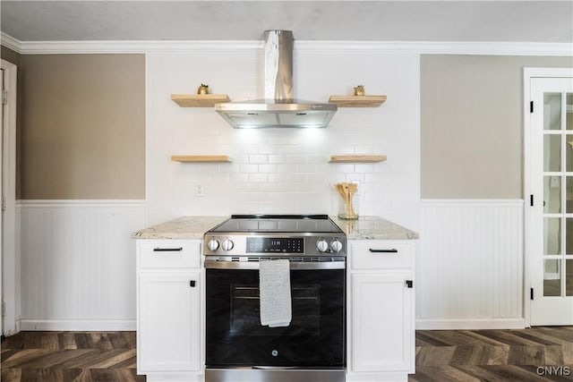 kitchen with island exhaust hood, white cabinets, dark parquet floors, and stainless steel range with electric cooktop