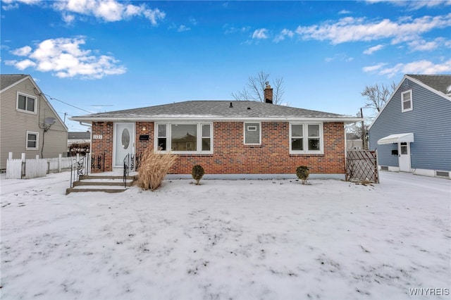 view of snow covered house