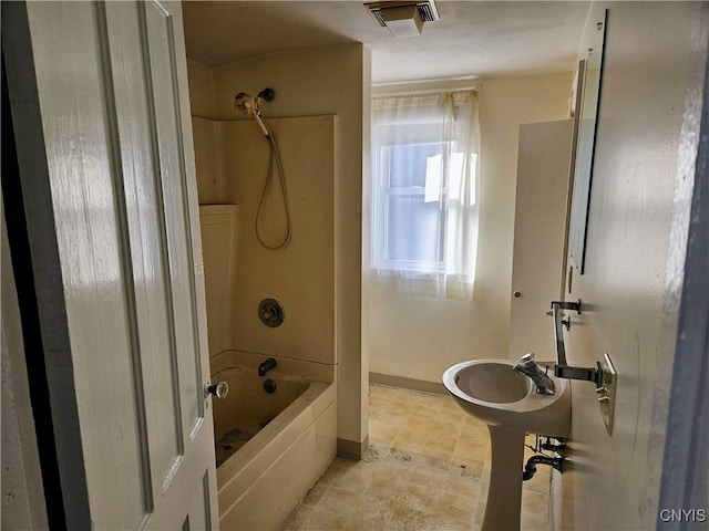 bathroom with shower / washtub combination