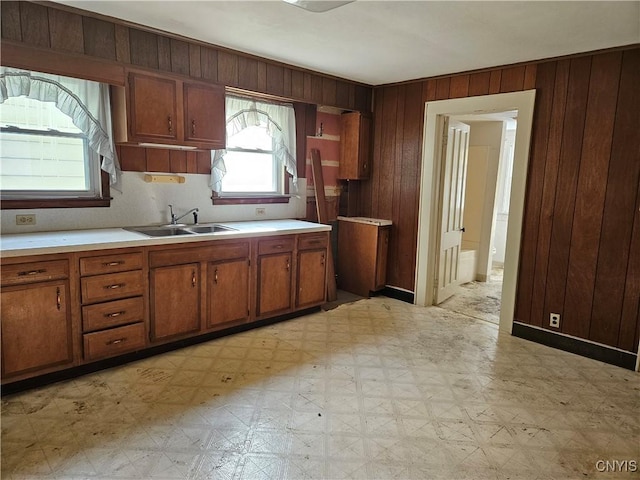 kitchen with wood walls and sink