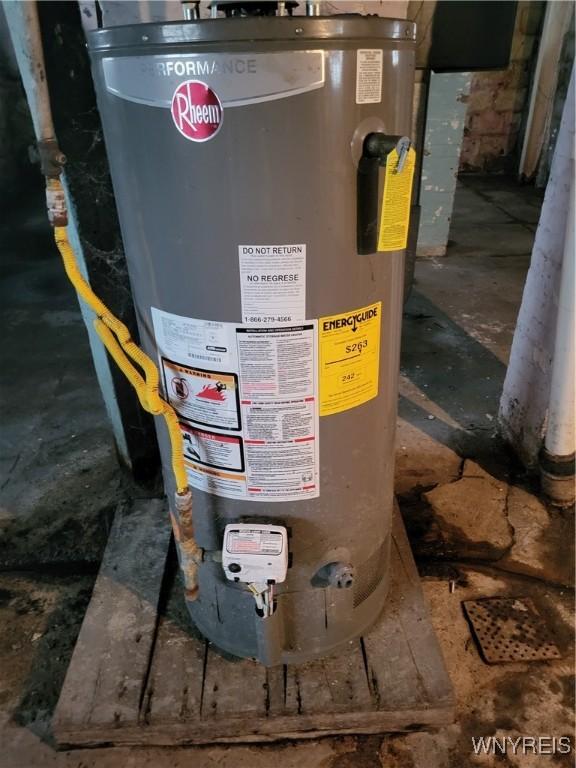 utility room featuring water heater