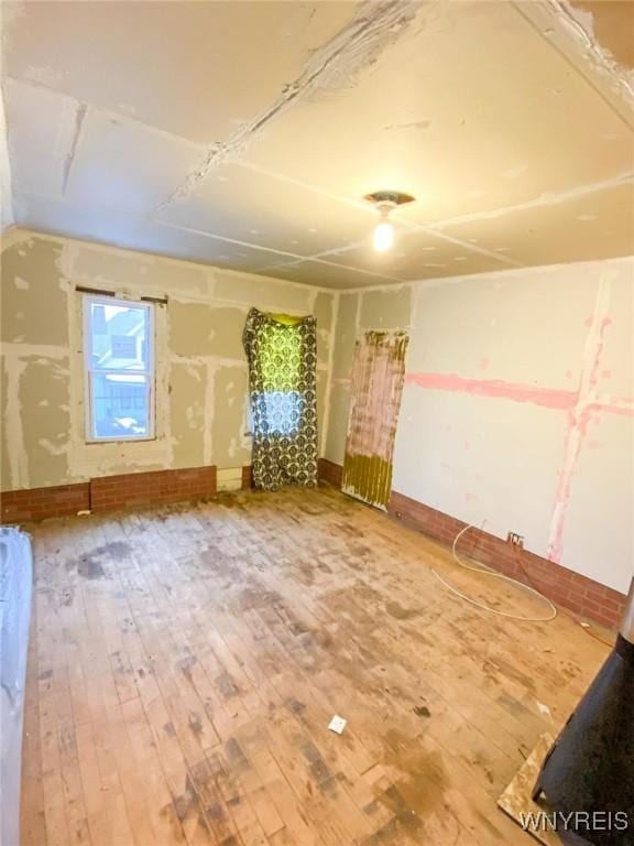 unfurnished room featuring wood-type flooring