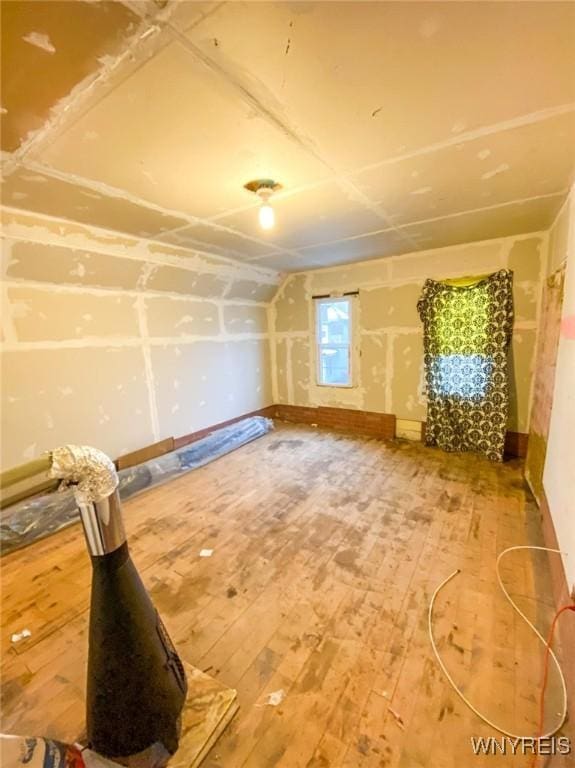 bonus room with hardwood / wood-style flooring