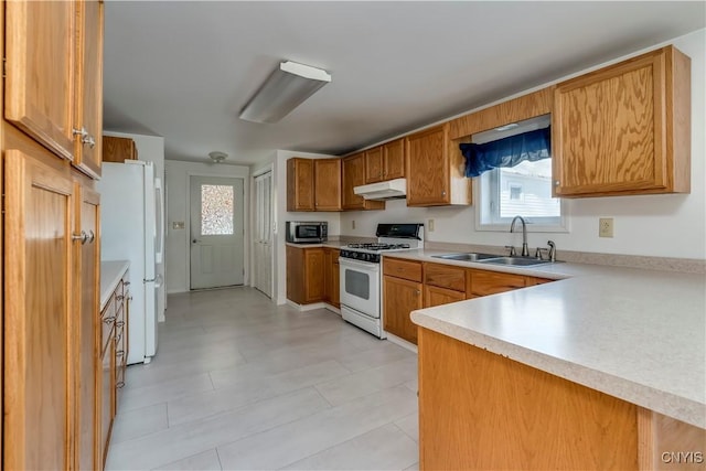 kitchen featuring white appliances and sink