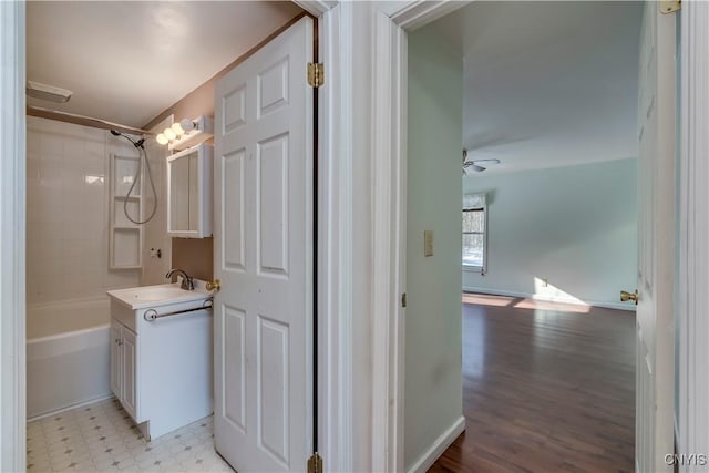 bathroom featuring vanity,  shower combination, and ceiling fan