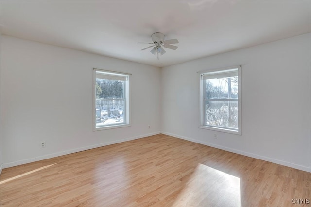 unfurnished room with ceiling fan and light hardwood / wood-style flooring