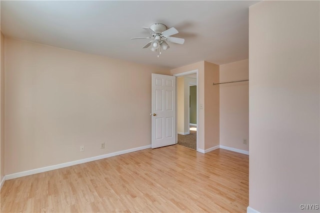 unfurnished room featuring ceiling fan and light hardwood / wood-style flooring