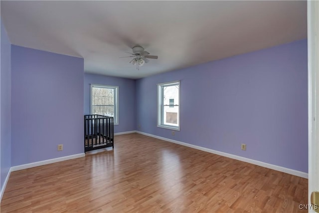 spare room with ceiling fan and light hardwood / wood-style floors