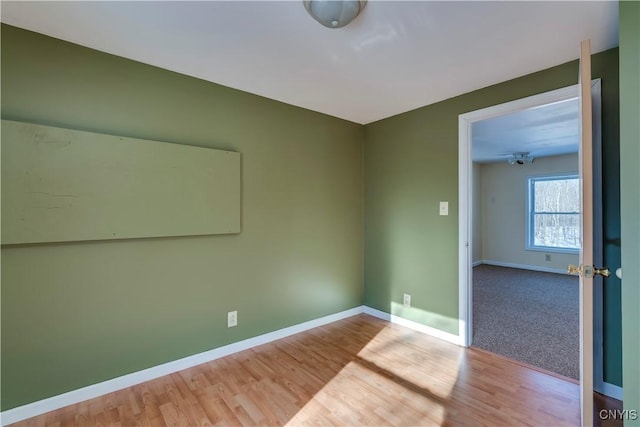 empty room with light wood-type flooring