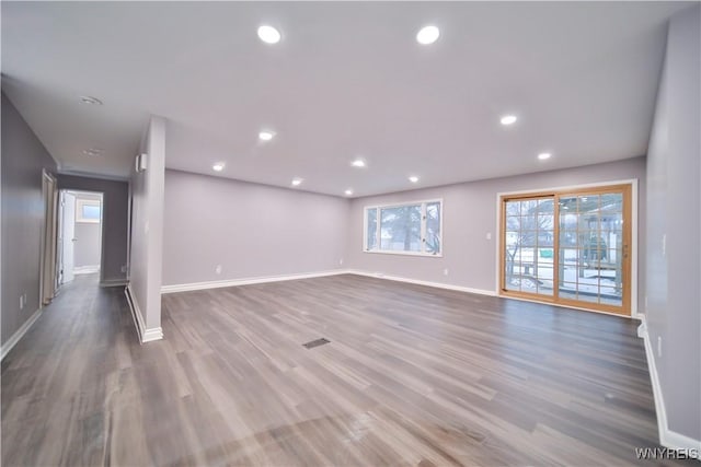 unfurnished room featuring hardwood / wood-style flooring