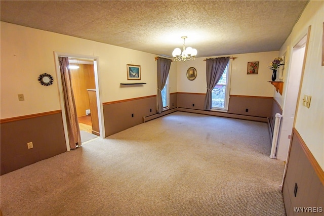 additional living space featuring a textured ceiling, light carpet, and an inviting chandelier