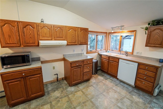 kitchen featuring lofted ceiling, baseboard heating, sink, and white dishwasher