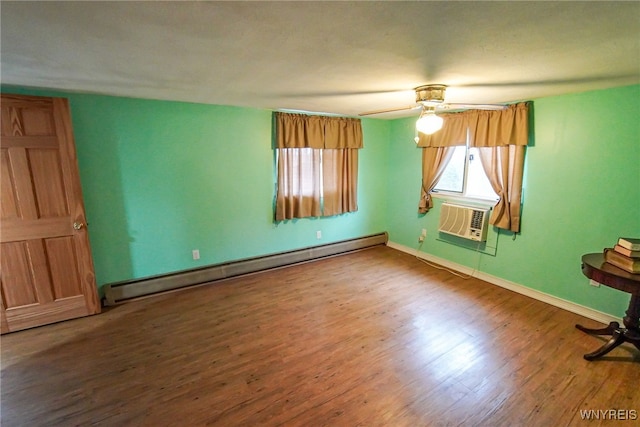 empty room featuring an AC wall unit, hardwood / wood-style floors, a baseboard heating unit, and ceiling fan