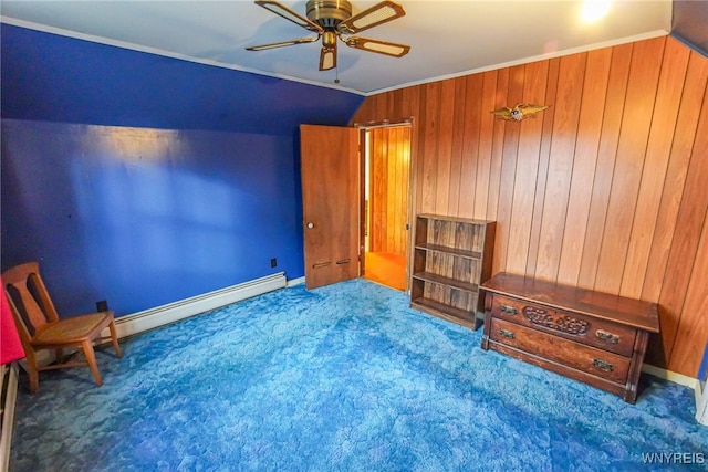 interior space with wood walls, ceiling fan, carpet flooring, a baseboard radiator, and ornamental molding