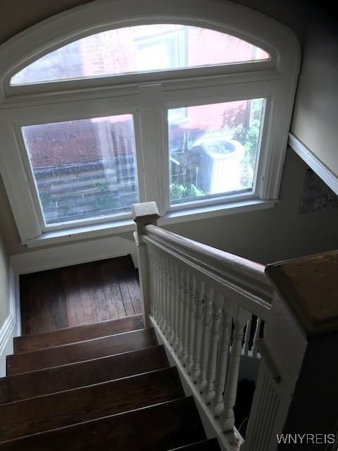 stairs featuring wood-type flooring