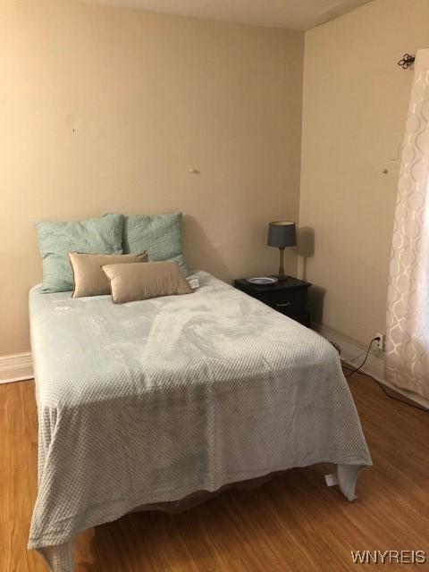 bedroom featuring wood-type flooring