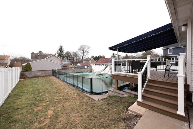 view of yard with a swimming pool side deck