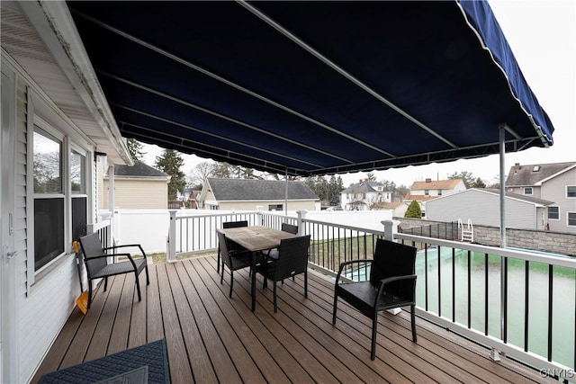 deck featuring a fenced in pool