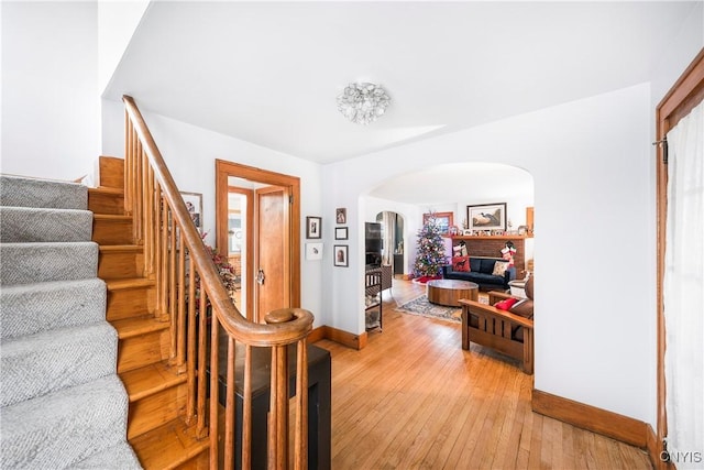 1 Alden Ave, Auburn, NY 13021 - foyer entrance featuring arched walkways, stairs, and light wood-style floors